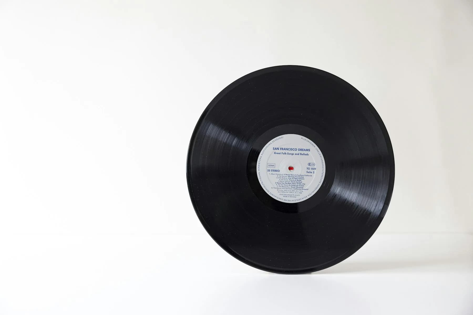 A vinyl record being cleaned